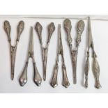 A collection of six glove stretchers, with decorative loaded silver handles