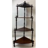 A Victorian rosewood four section whatnot, with barley twist supports, 120cm high, 54cm wide, 34cm
