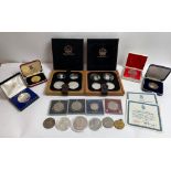 Two Canadian silver Olympic sets, along with various other commemorative coins