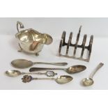 Silver toast rack, by Mappin & Webb; with a silver sauce boat, by C. J. Vander Ltd; a silver and