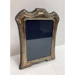 A silver photograph frame, by R. Carr, Sheffield 1994, the rectangular frame 17.5cm high, image area