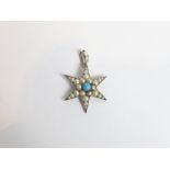 A starburst pendant, stamped 'Sterling' and set with simulated pearls and a simulated turquoise,