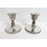 A pair of silver loaded desk candlesticks, stamped 'Plata 925', 7.5 cm high