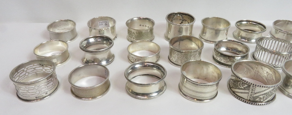 A collection of twenty one silver napkin rings, various dates and makers, 285 g (9.1 troy ozs) - Image 3 of 3