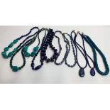A collection of gemstone necklaces, including lapis lazuli, chrysocolla and turquoise; of varying