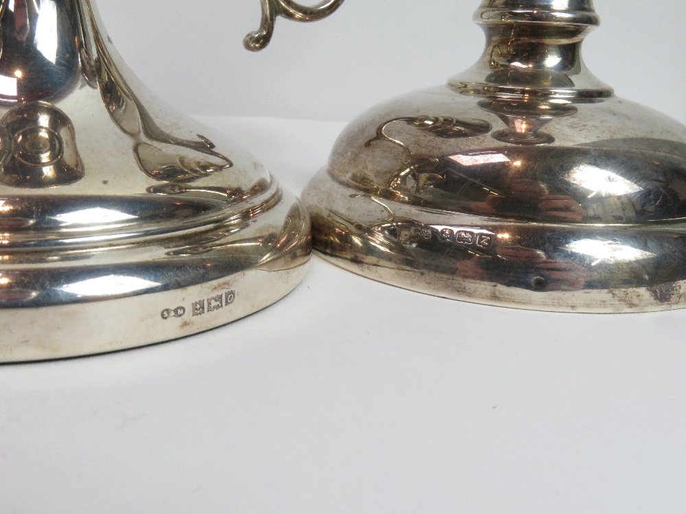 A loaded silver two light short candelabra, Birmingham 1963, 9 cm high; with a single loaded - Image 2 of 2