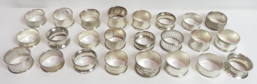 A collection of twenty one silver napkin rings, various dates and makers, 285 g (9.1 troy ozs)