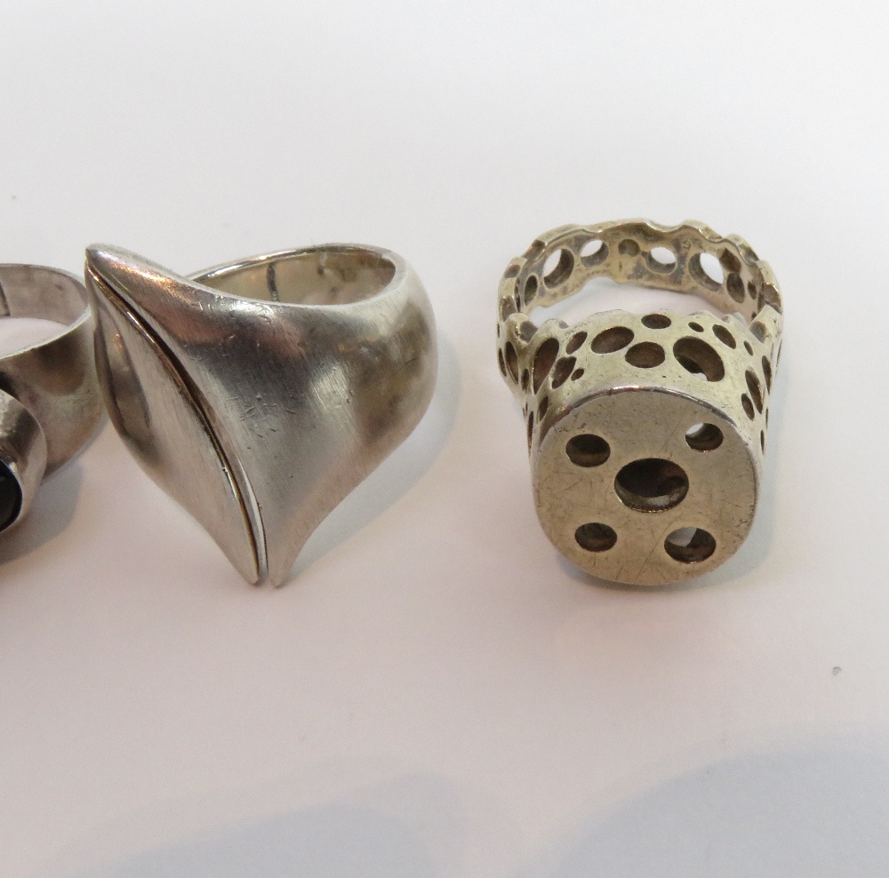 A Danish silver ring, stamped 'COF'; three other silver modernist rings; and a pair of silver gilt - Image 3 of 3