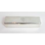 A silver box, by Liberty & Co, Birmingham 1938, of long rectangular outline, the hinged cover