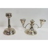 A loaded silver two light short candelabra, Birmingham 1963, 9 cm high; with a single loaded