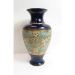 A Doulton stoneware vase, with central floral panel, 36cm high