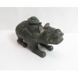 A heavy Chinese bronze censer of a standing beast with decorative carving, 22cm long, 11cm high