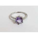 A 9 carat white gold stone set dress ring, by Gem TV, with central round cut purple stone