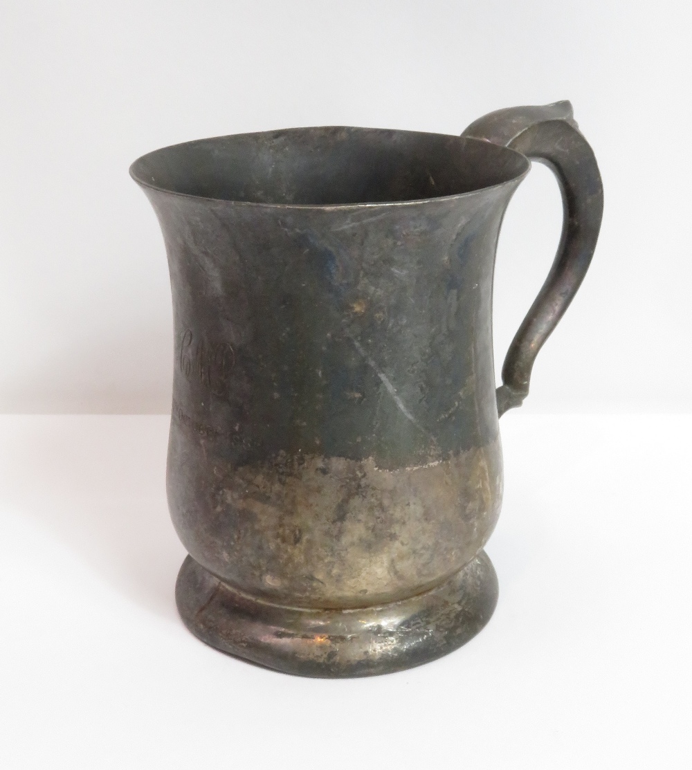 A silver mug, by Edward Viner, Sheffield 1960, of baluster form with leaf capped scroll handle,