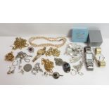 A small collection of costume jewellery items, housed in a jewellery case