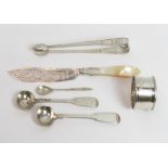 A pair of Georgian silver sugar tongs; a pair of silver salt spoons, by William Eaton; a silver