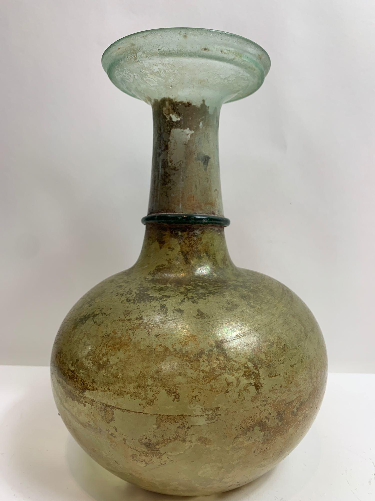 A Roman glass bottle, standing on a concave base with a green ring around the neck, probably 1st-2nd - Image 4 of 7