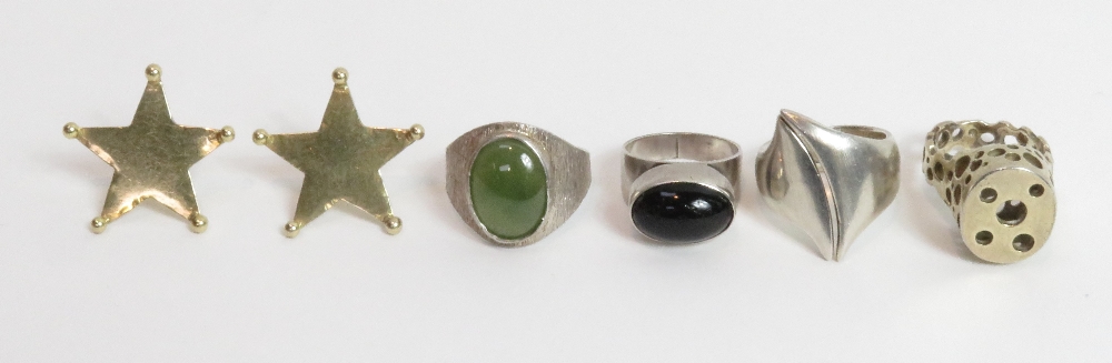 A Danish silver ring, stamped 'COF'; three other silver modernist rings; and a pair of silver gilt