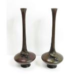 A pair of Meiji period Japanese bronze stem vases, raised on bulbous base each with an applied frog,