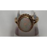 A 9ct gold opal single stone ring, finger size K, 3.4g gross