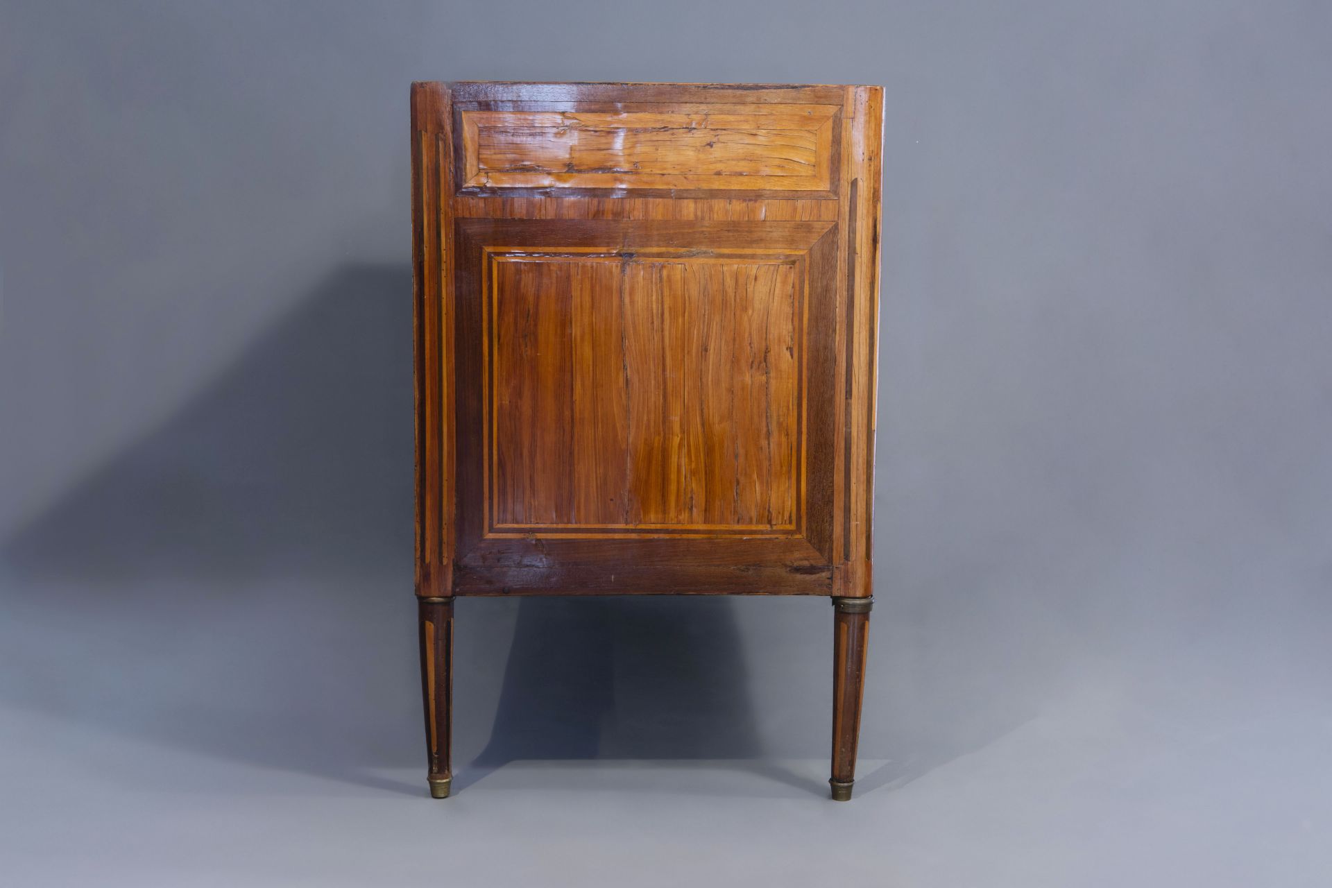 A French mahogany veneered Louis XVI chest of drawers with marble top, late 18th C. - Image 5 of 11