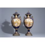 Pair of French gold layered blue ground S!vres style vases w. love scenes by Jeanne, 19th/20th C.