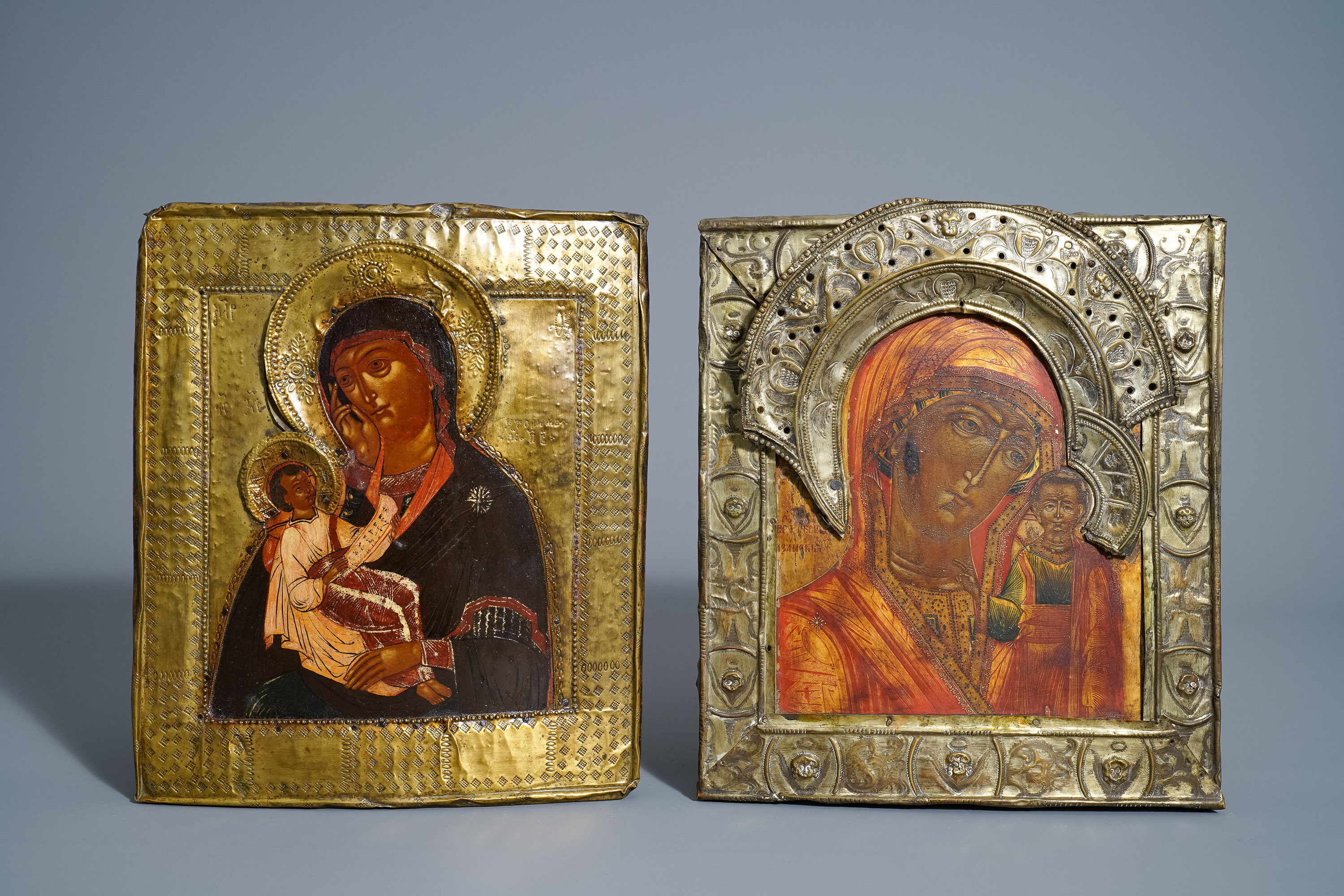 Two Russian 'Mother of God' icons with copper oklad or riza, 19th C.