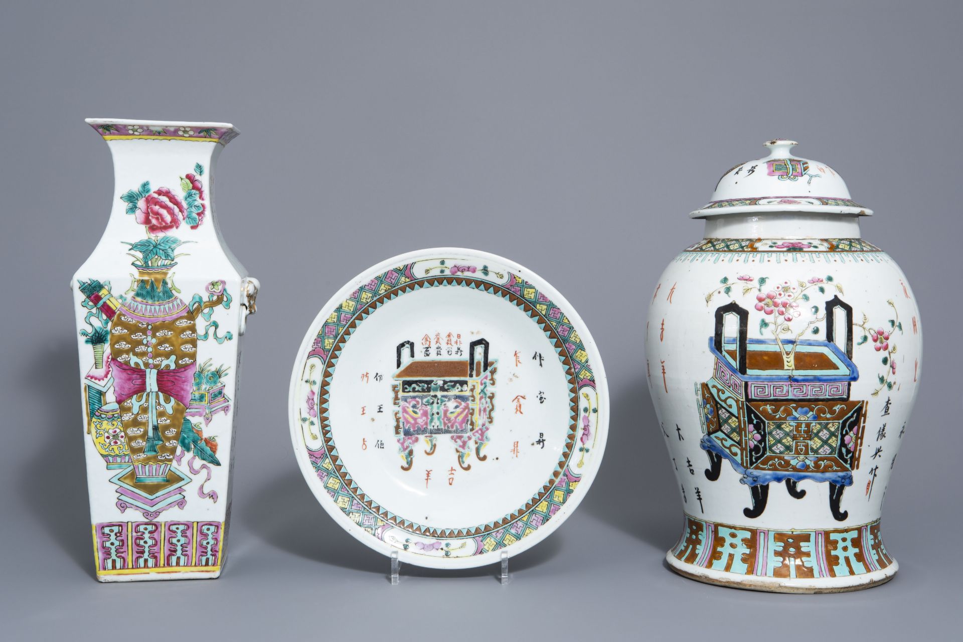 Two Chinese famille rose vases and a charger with incense burners and jardinires, 19th C.