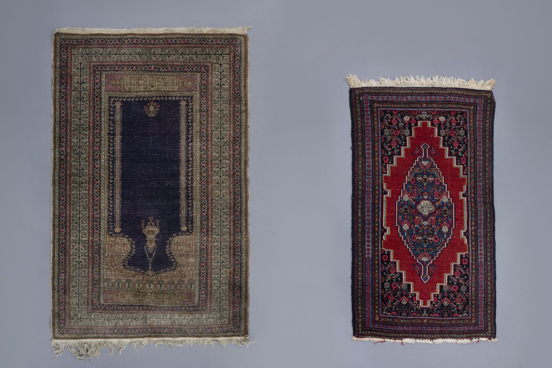 Two Oriental prayer rugs with verses, wool and silk on cotton, first half of the 20th C.