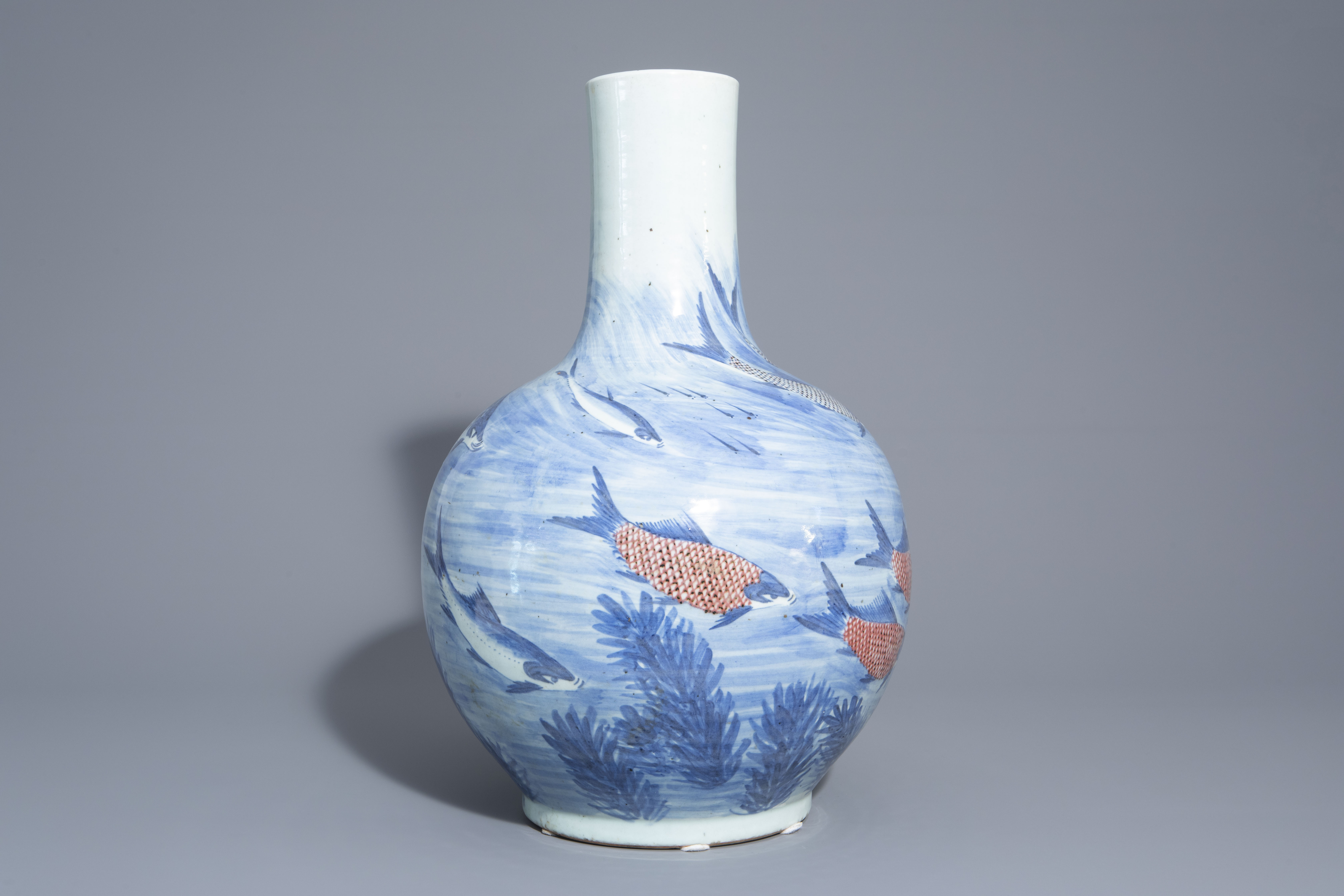 A large Chinese blue, white and copper red bottle shaped 'carps' vase, 20th C. - Image 2 of 6