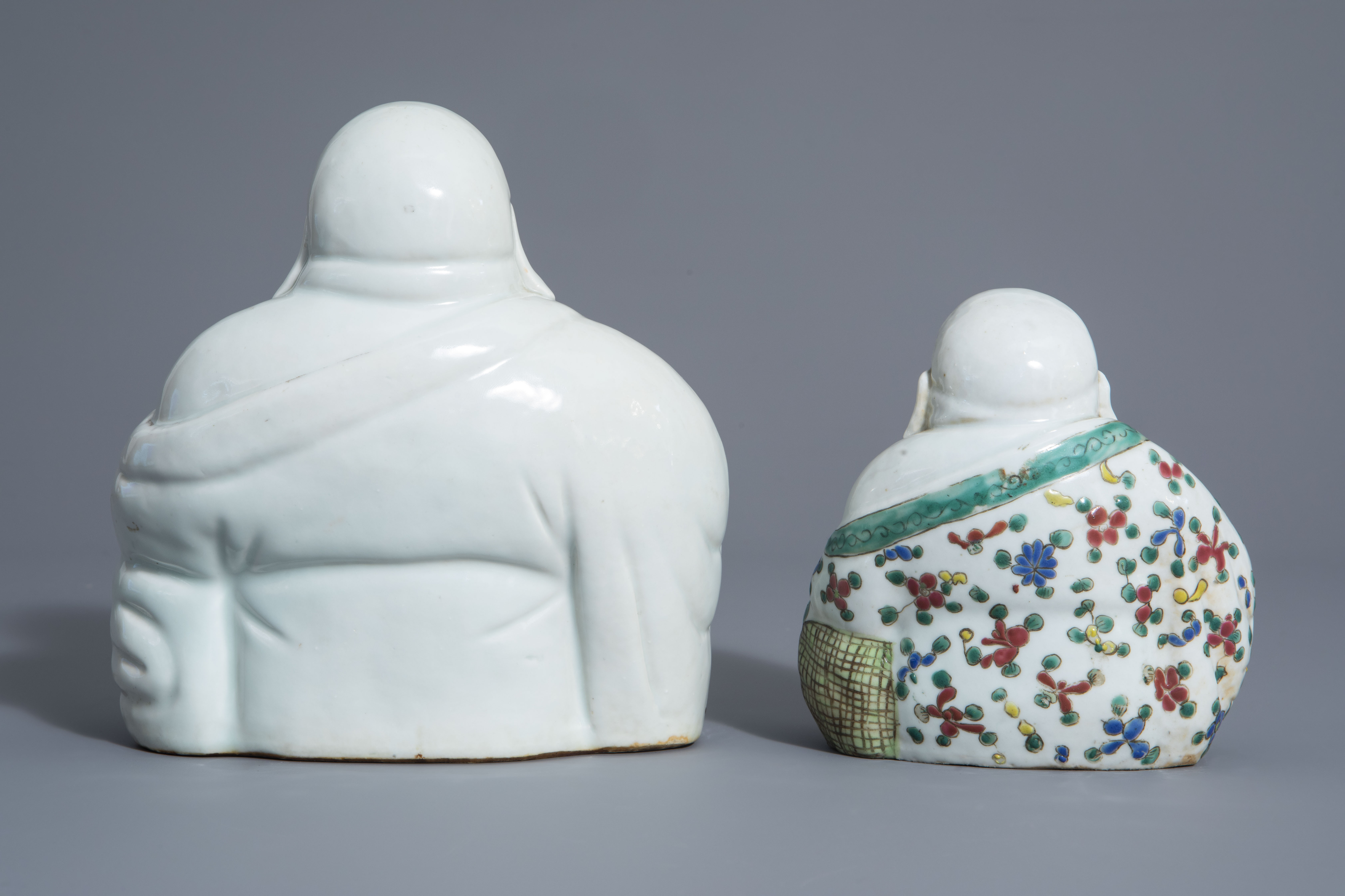 Two Chinese white, iron red, gilt and famille rose porcelain figures of Buddha, 19th/20th C. - Image 4 of 7