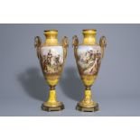 A pair of French Svres style gold on yellow ground vases with scenes by Chanle, 19th C.