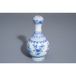 A Chinese blue and white garlic-head mouth vase with floral design, Qianlong mark, 20th C.