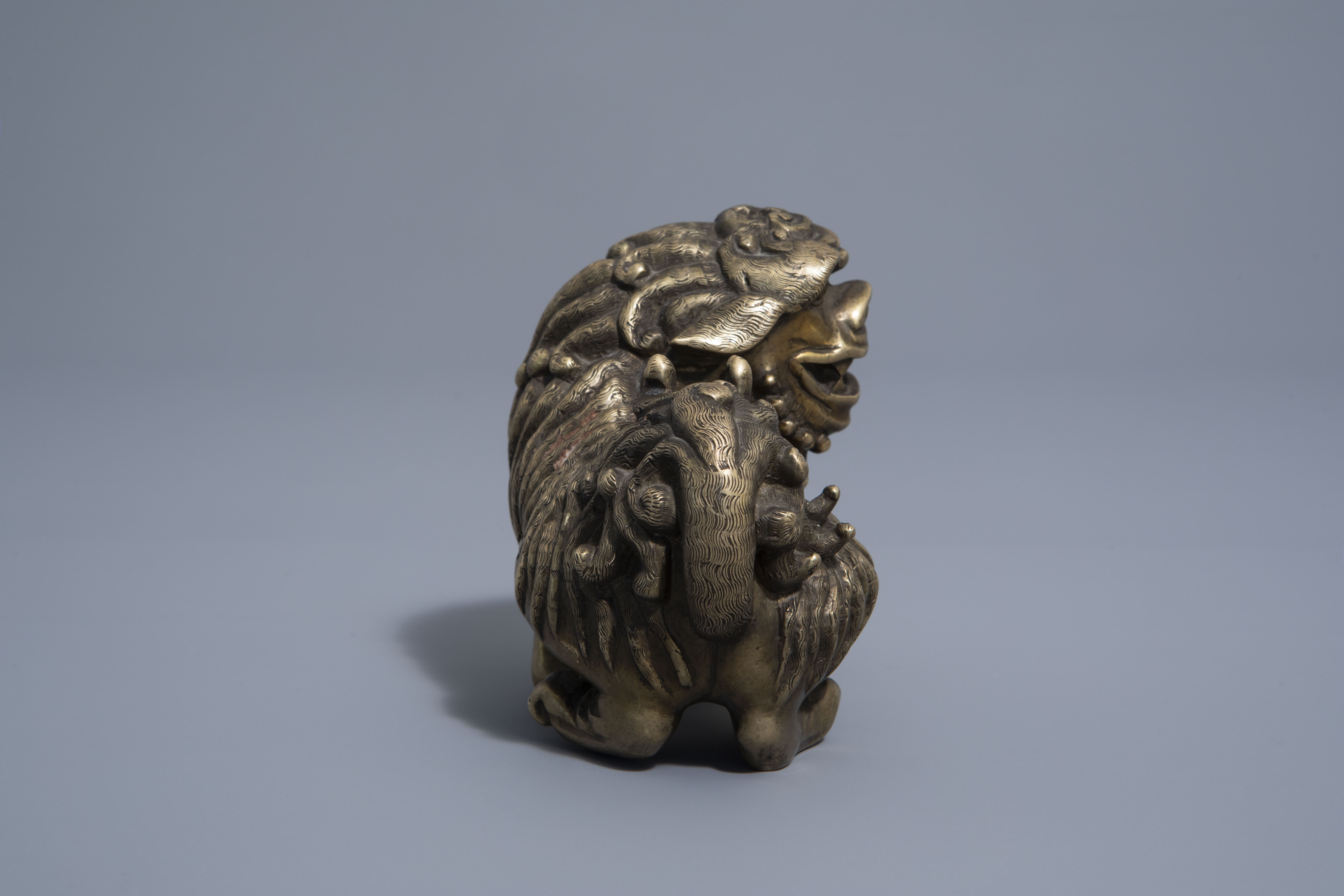 A Chinese bronze model of a Buddhist lion, late Qing - Image 3 of 7