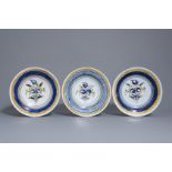 Three polychrome Brussels faience plates with flowers, about 1800