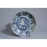 A large Chinese blue and white Swatow charger with phoenixes, Wanli