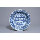 A large Chinese blue and white Swatow charger with a landscape, Wanli