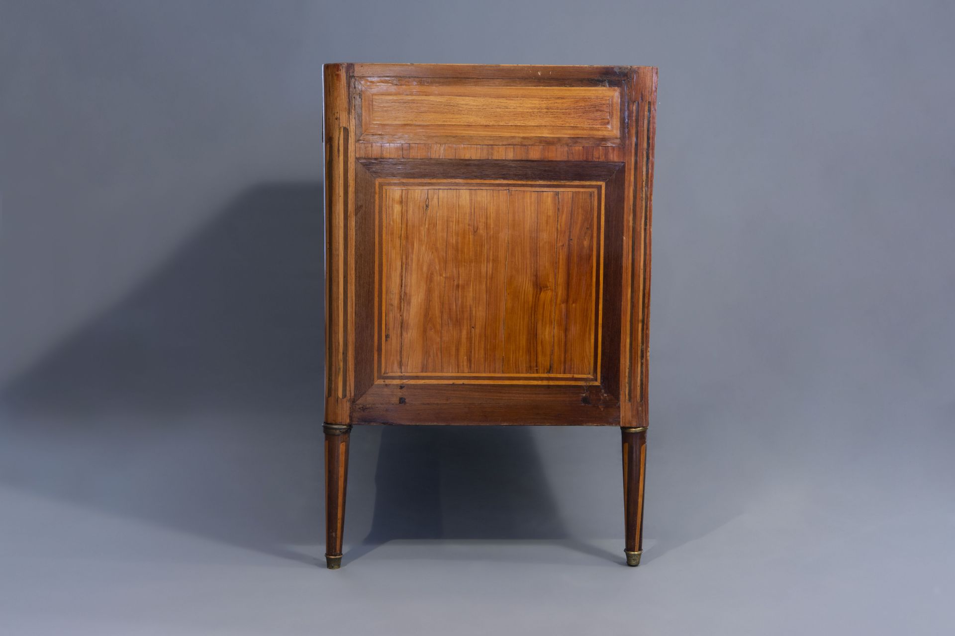 A French mahogany veneered Louis XVI chest of drawers with marble top, late 18th C. - Image 3 of 11