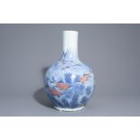 A large Chinese blue, white and copper red bottle shaped 'carps' vase, 20th C.