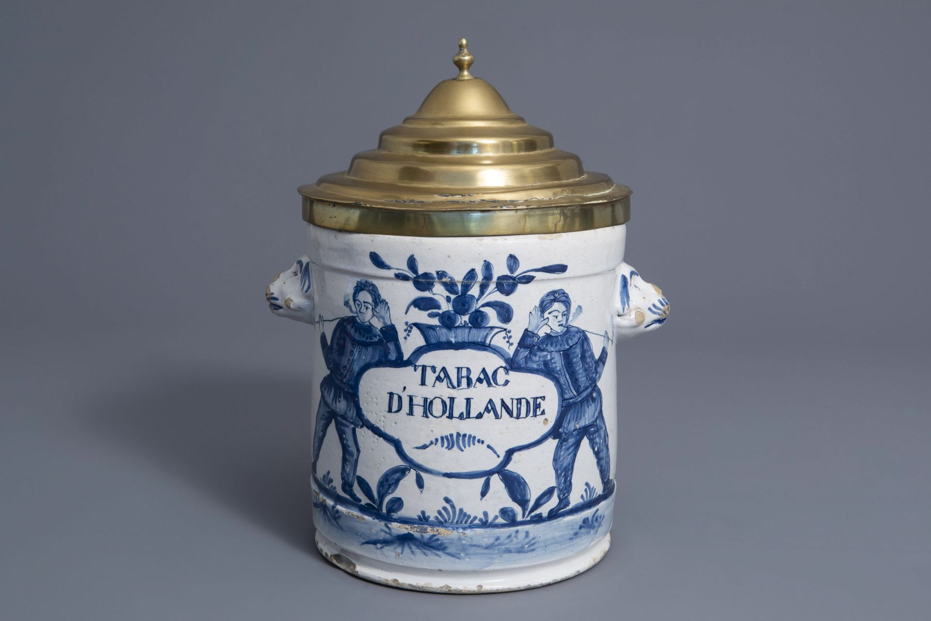 A Brussels brass covered blue and white faience 'Tabac d'Hollande' tobacco jar, late 18th C.
