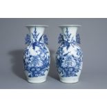 A pair of Chinese blue and white vases with a bird among flowers, 19th C.