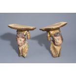 A pair of German polychrome painted & gilt wooden putti, made into pedestals, 18th C. and later