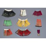 A collection of Chinese embroidered silk girls' skirts, 19th/20th C.