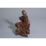 A Chinese carved root wood figure of Shou Lao, 19th C.