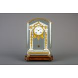 A French white marble and gilt bronze portico clock under glass dome and on a wooden base, 19th C.