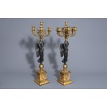 After Thomire: Pair of Empire style gilt and patinated bronze seven light candelabra, 19th/20th C.