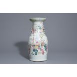 A Chinese famille rose vase with figurative design all around, 19th C.