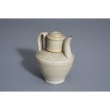 A Chinese monochrome celadon ewer and cover, prob. Song