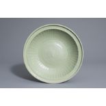 A Chinese Longquan celadon dish with incised design, Ming