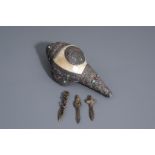 A Tibetan silver mounted conch shell horn and three ceremonial daggers, 19th/20th C.